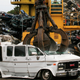A van gets crushed as part of the Cash for Clunkers program, 2009.